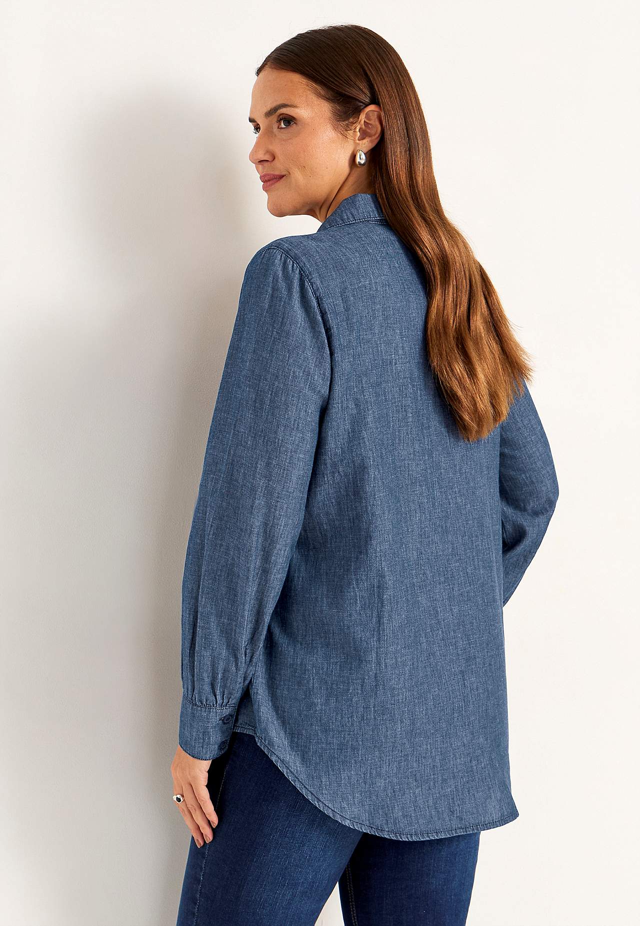 Denim blouse with sewn pleats