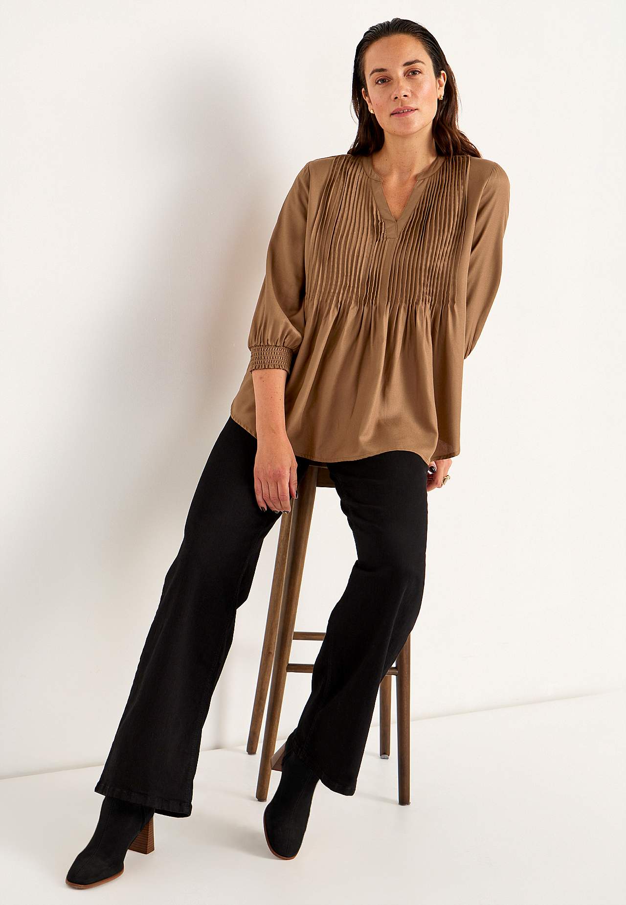 Blouse with stitched pleats