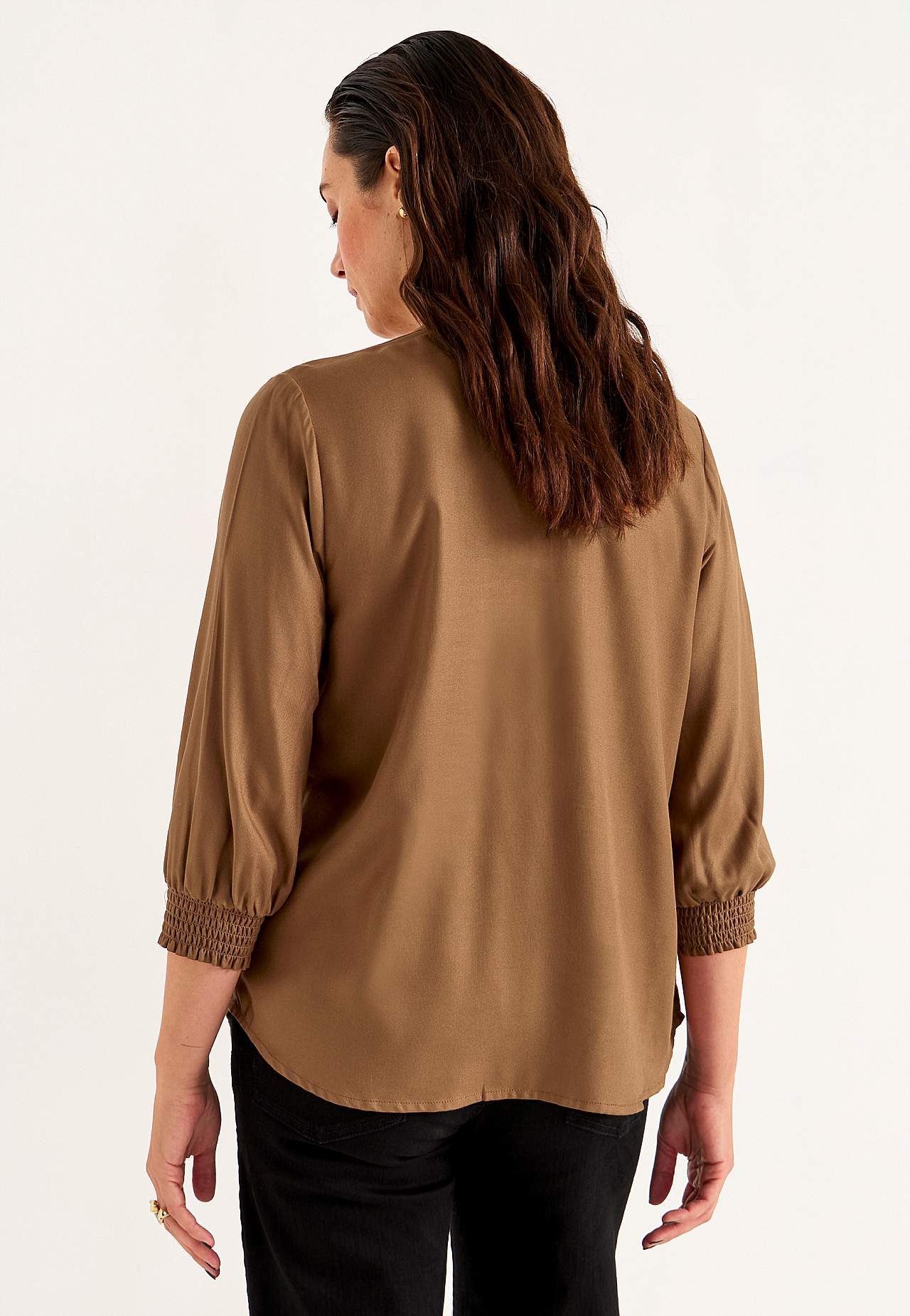 Blouse with stitched pleats