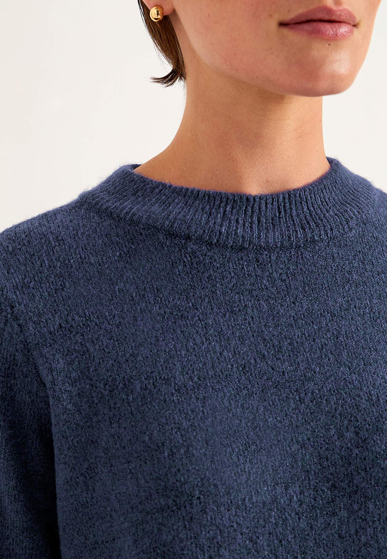Knitted sweater with round neck