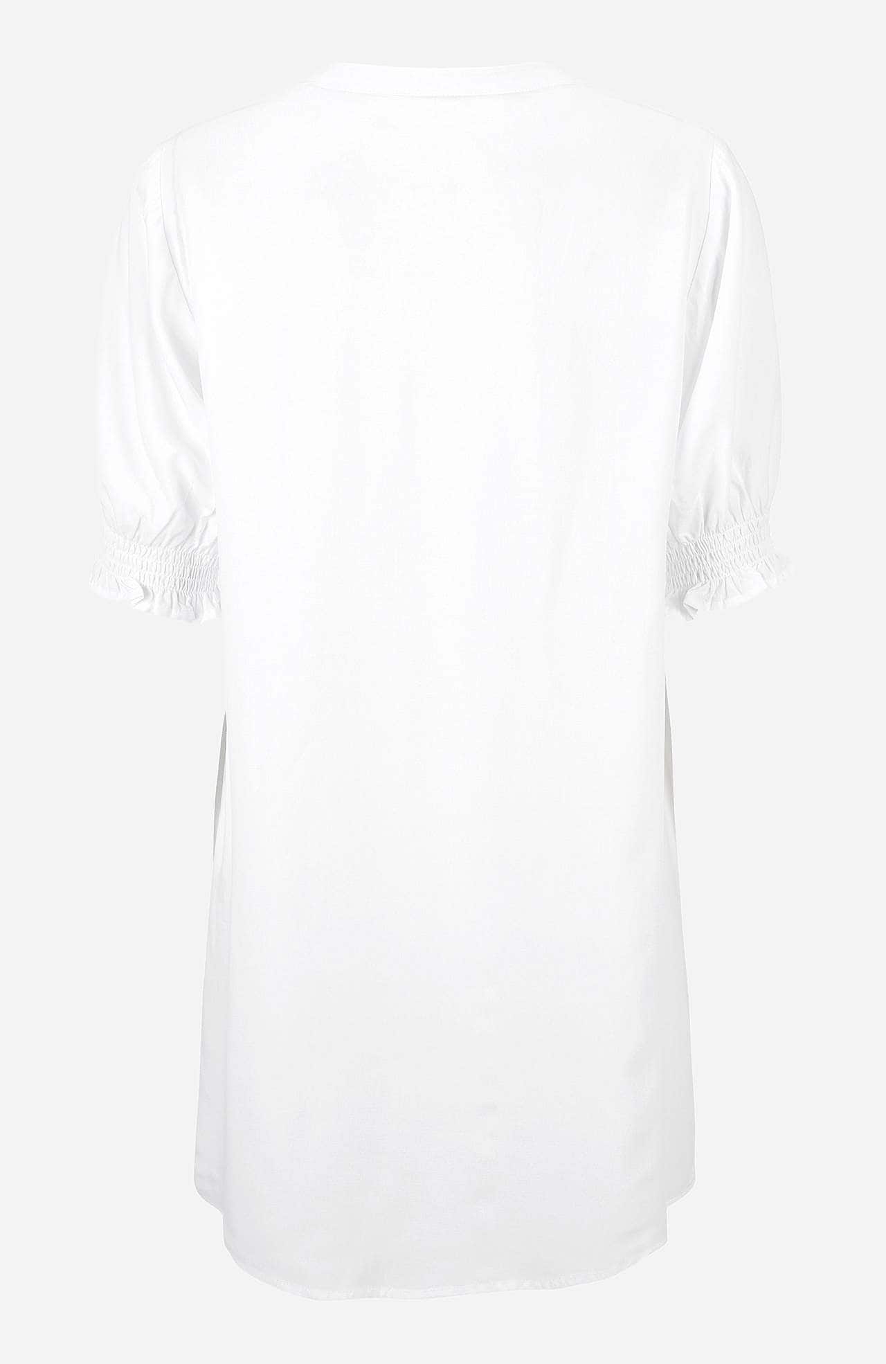 Tunic with smocking on the sleeve ends