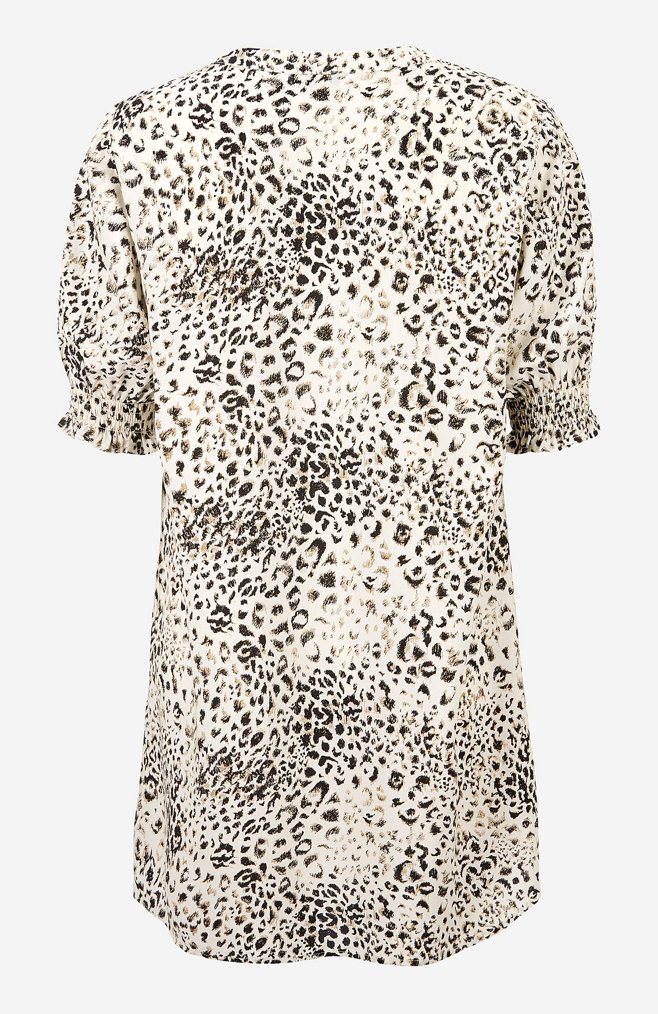 Tunic with smocking on the sleeve ends