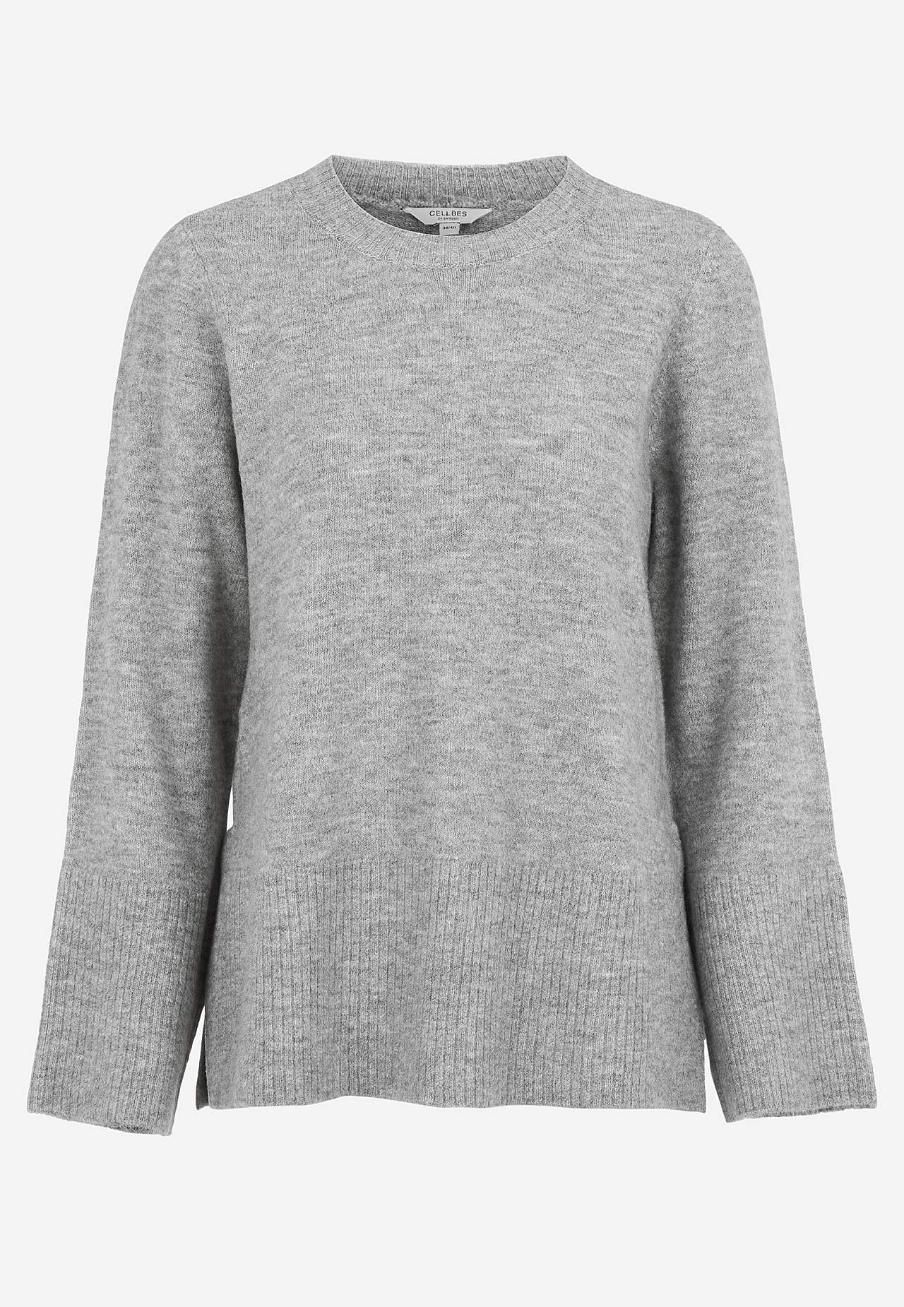 Knitted sweater with slits
