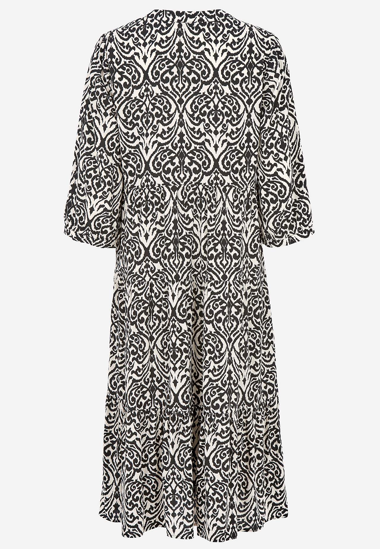 Dress with flounces