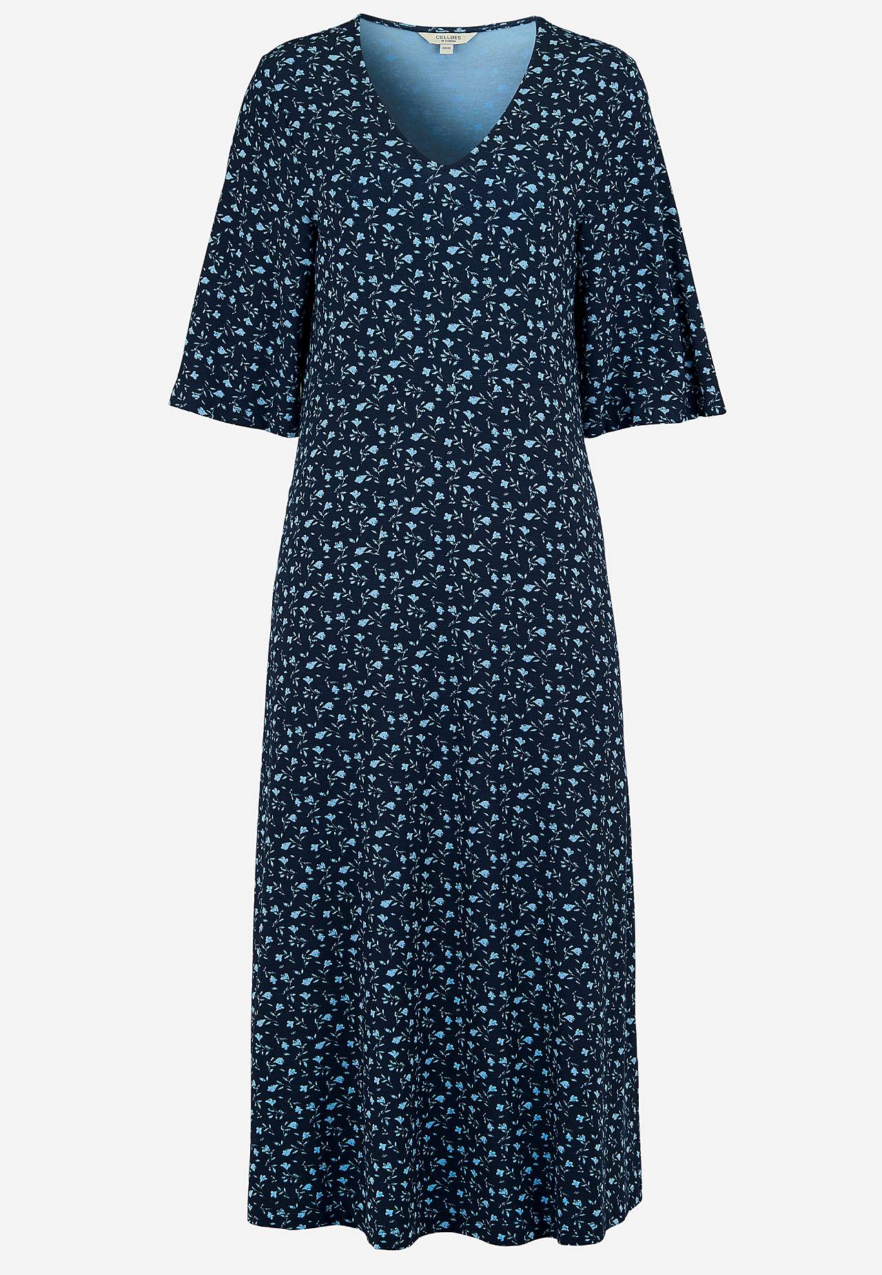 Jerseykjole med et blomstermønster og lommer