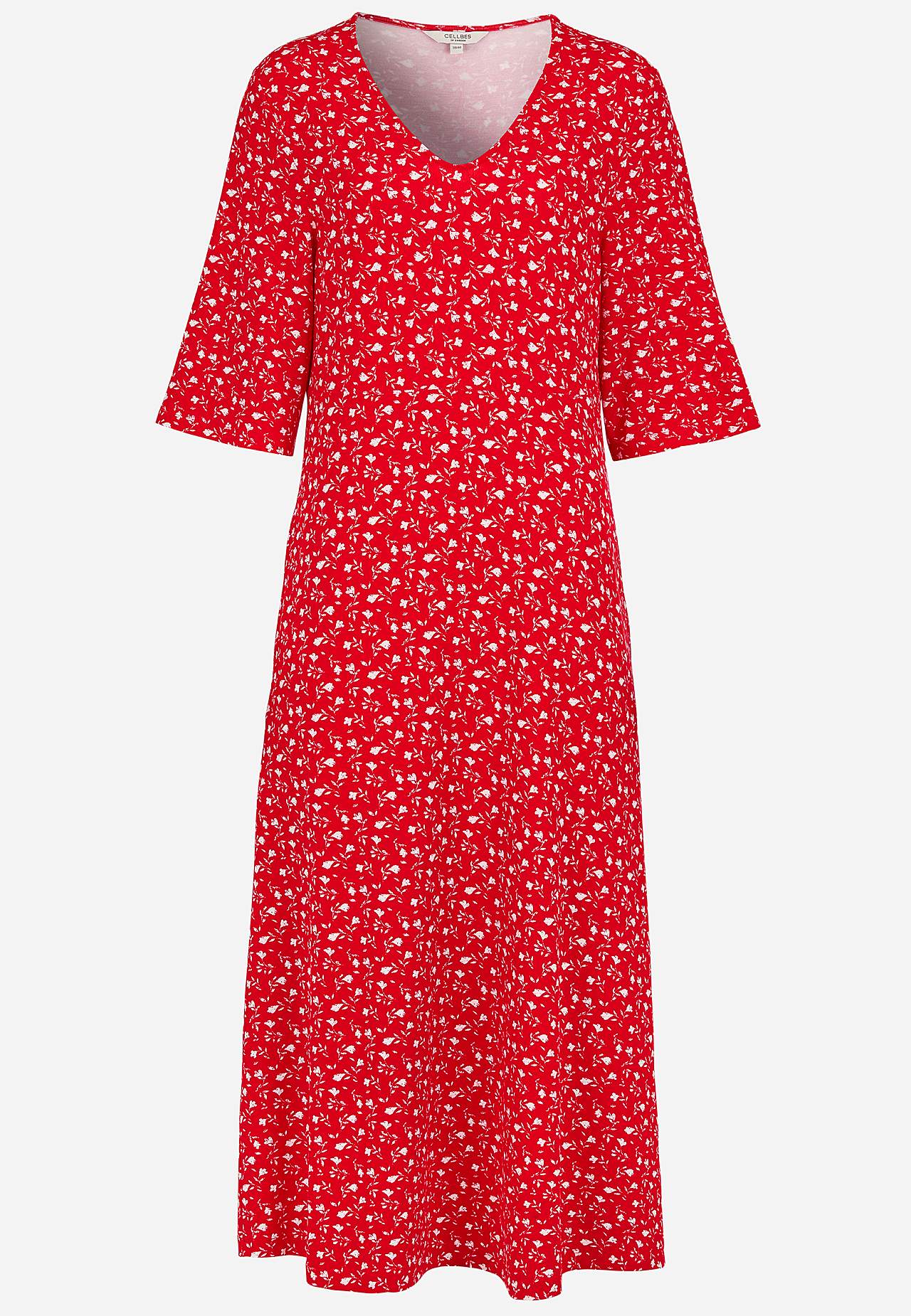 Jerseykjole med et blomstermønster og lommer